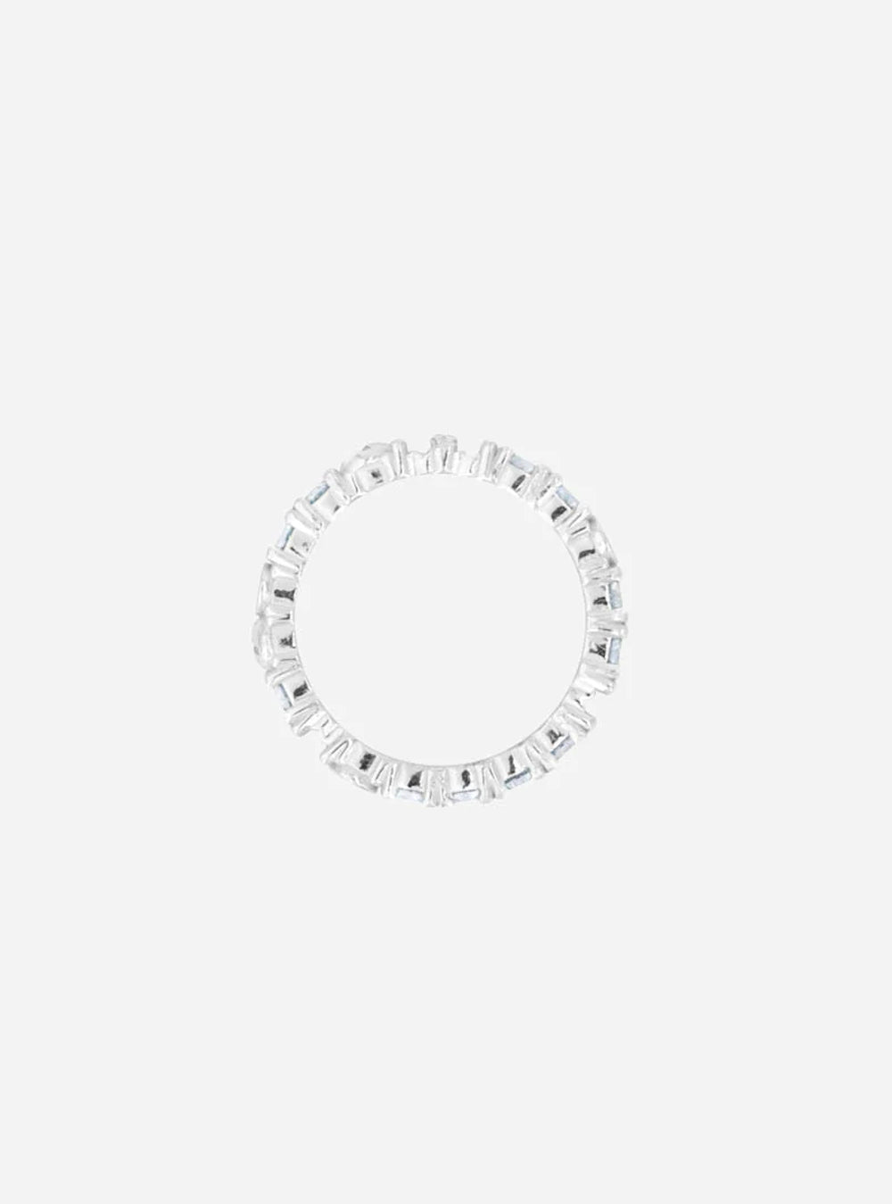 a Broken eternity ring with gray moissanite from MIDNIGHTFACTORY on a white surface.