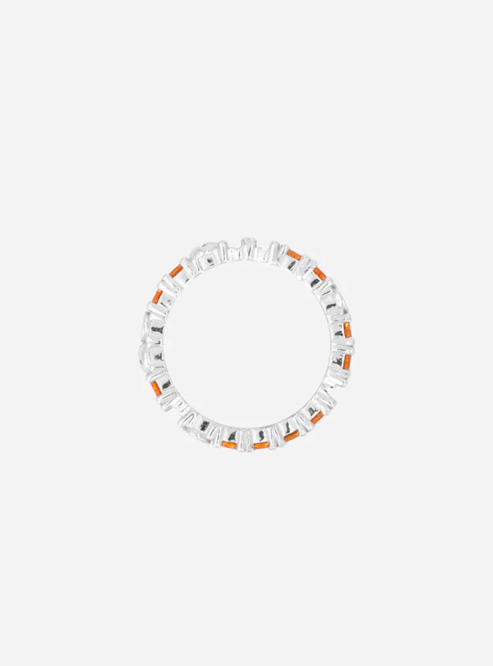 A MIDNIGHTFACTORY Broken eternity ring with sapphire on a white background.