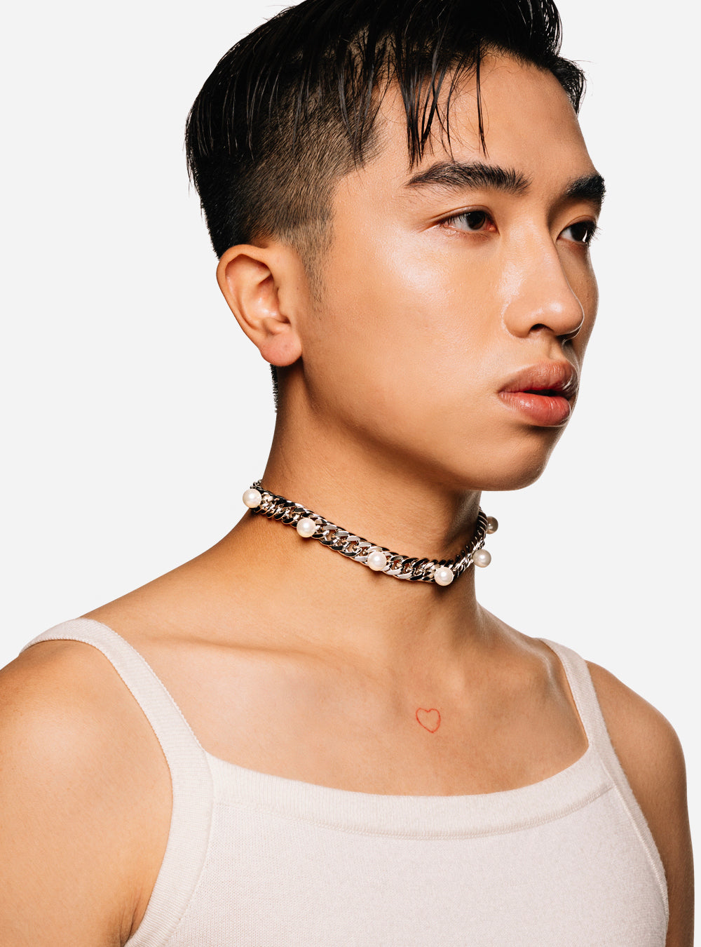 A man wearing a white tank top and a Pearls on curb-chain choker necklace by MIDNIGHTFACTORY.