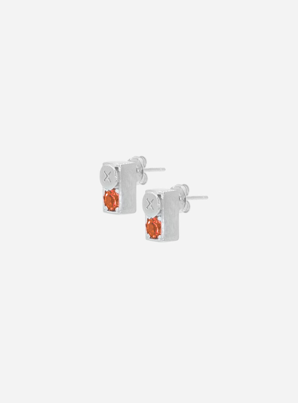 a pair of MIDNIGHTFACTORY Screwbox sapphire earrings with orange stones.