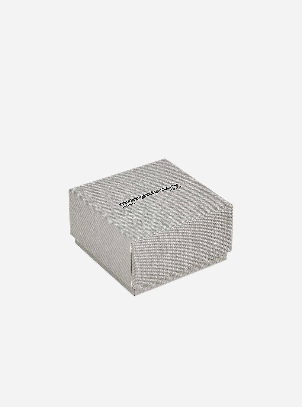 A small grey box with the MIDNIGHTFACTORY logo on it.