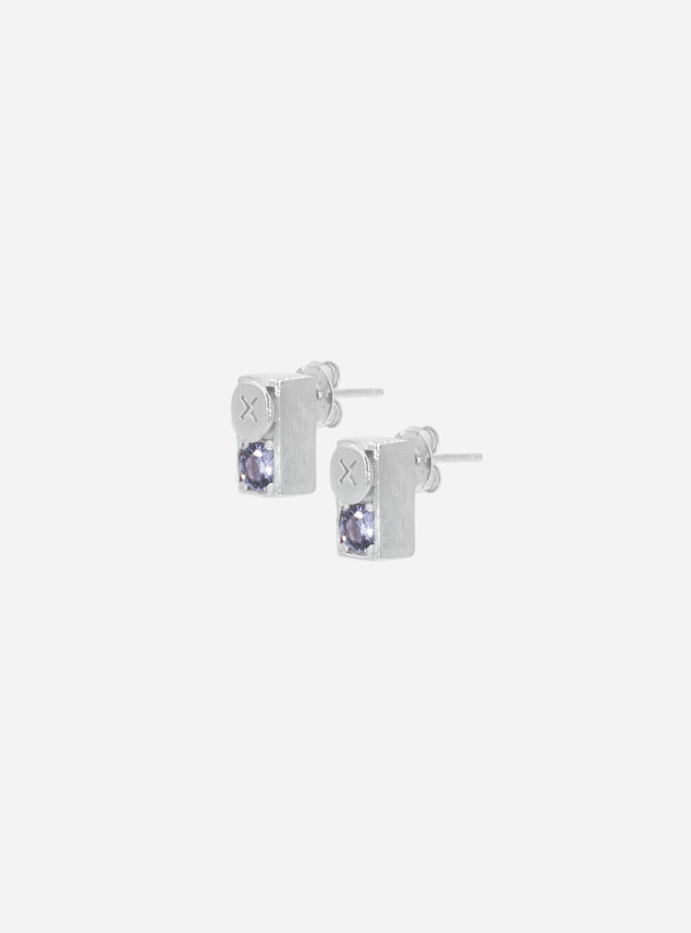 a pair of MIDNIGHTFACTORY Screwbox colour-changing earrings with a purple stone.
