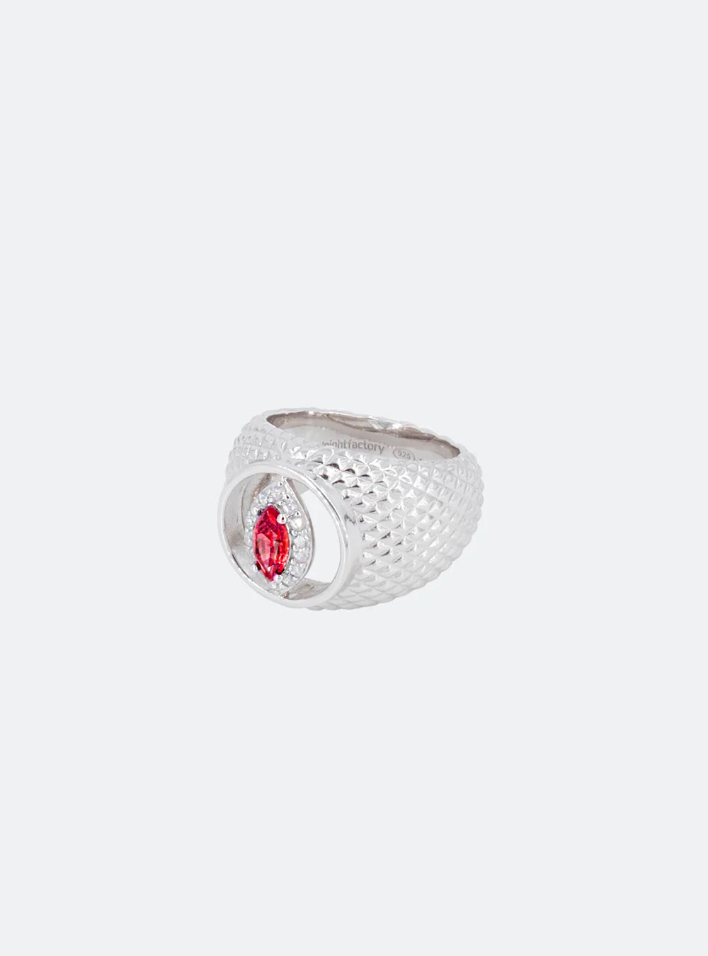 A MIDNIGHTFACTORY Cat-eye cutout Padparadscha cocktail signet ring with a red stone.