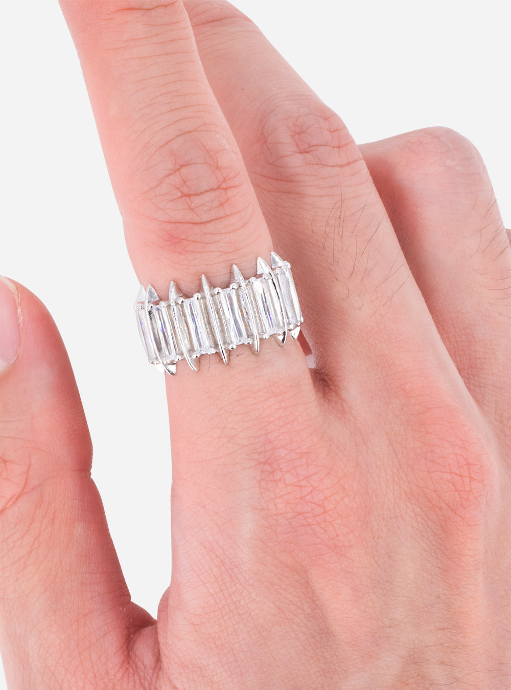 A woman's hand holding a Talon eternity ring by MIDNIGHTFACTORY.