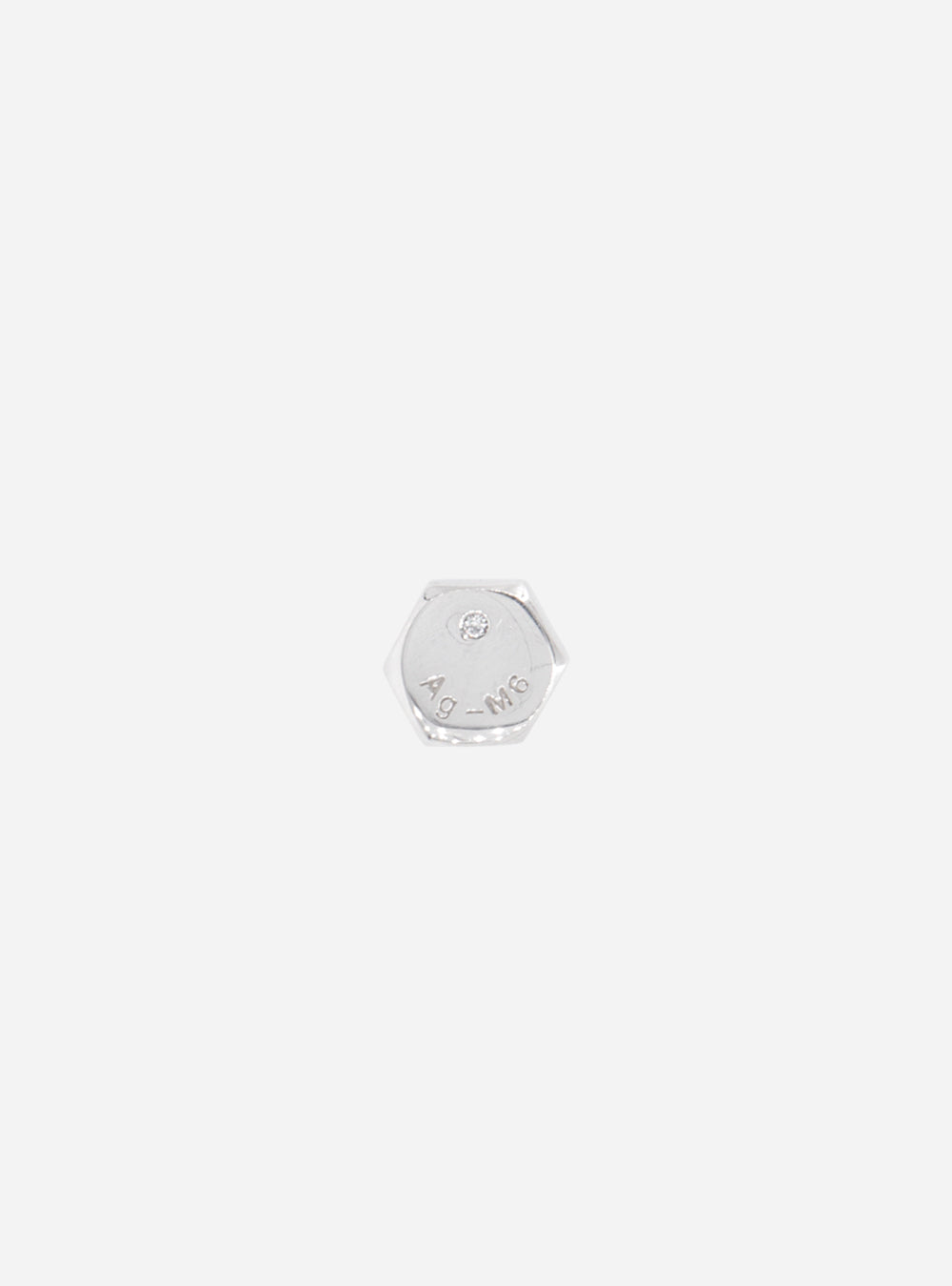 a small Hex-bolt lab-grown diamond earring by MIDNIGHTFACTORY on a white background.