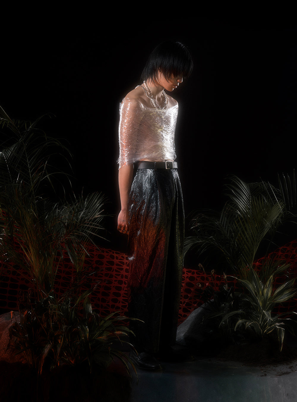 a man in a white shirt standing in front of plants wearing a MIDNIGHTFACTORY Burnt pearls with silver beads necklace.