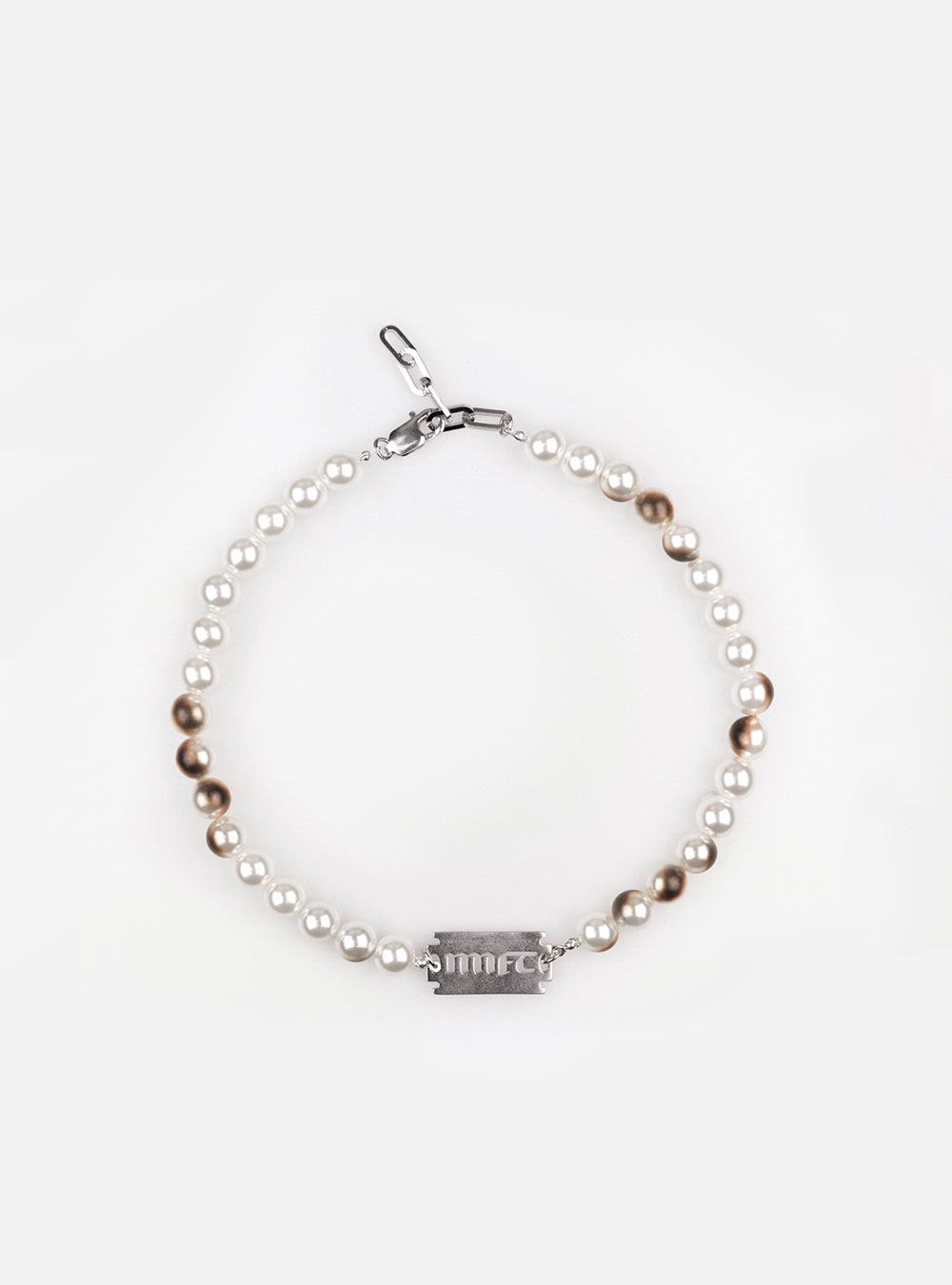 a Burnt pearls with MNFT blade choker necklace from MIDNIGHTFACTORY.